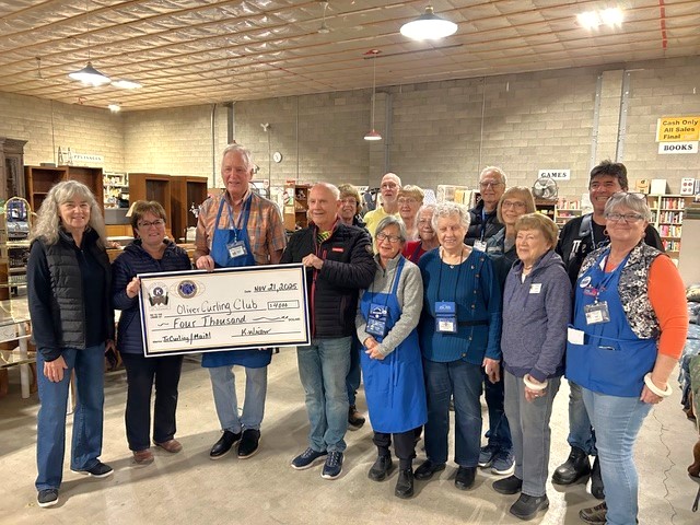 Photo of Presentation by Kiwanis volunteers to Oliver Curling Club